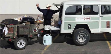 Val grilling and serving wine from his 1951 Willys Jeep